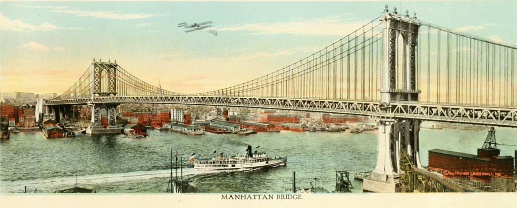 The Manhattan Bridge with a boat and airplane circa 1919